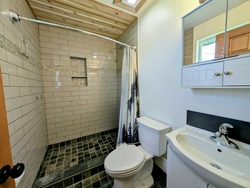 The ensuite to the main bedroom, with a tiled shower