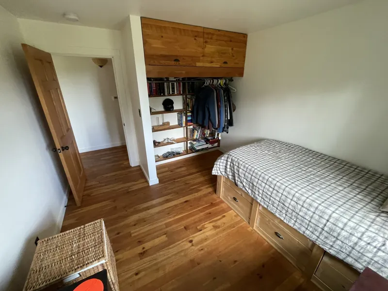 The second bedroom: fir cabinetry over the bookshelves