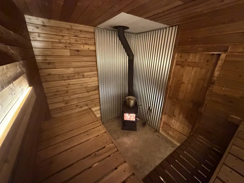 The sauna's wood stove, glowing